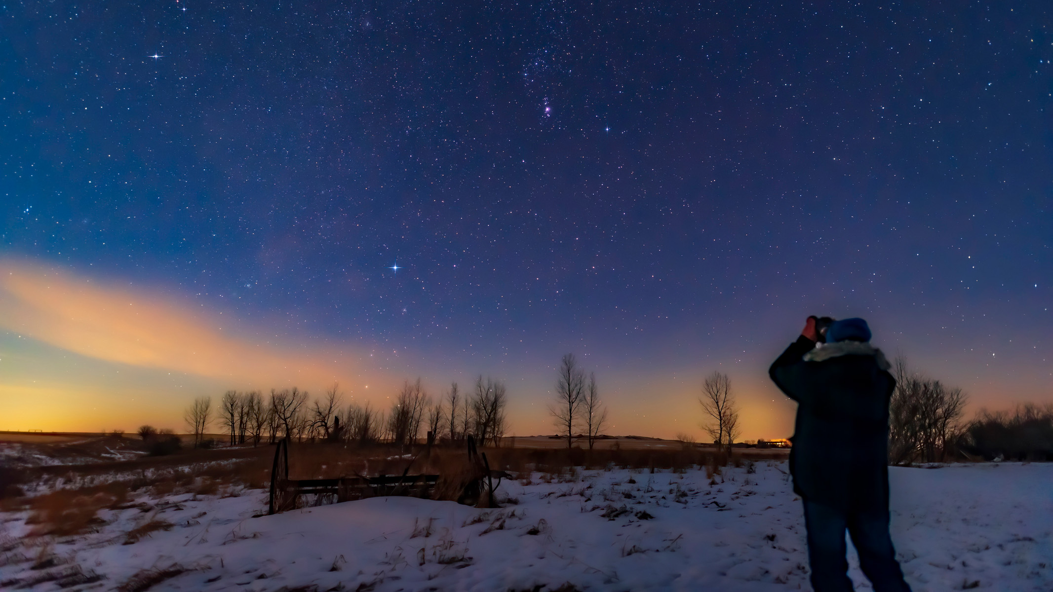 person using binoculars for stargaze