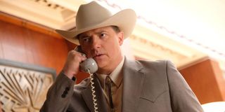 Brendan Fraser takes a phone call looking rather upset in Trust.