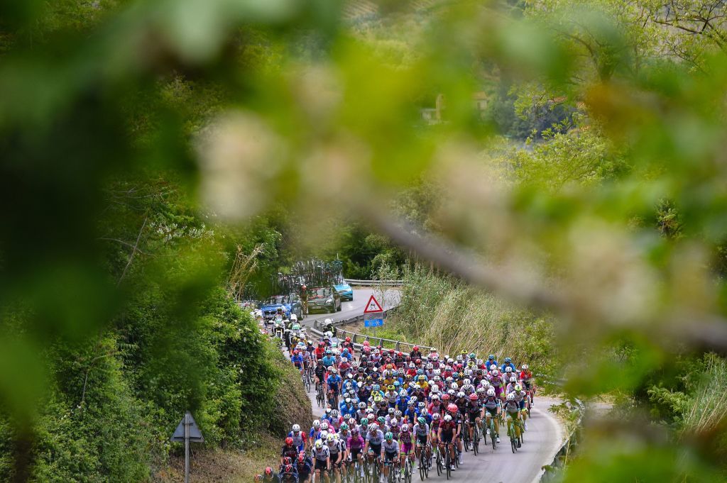 The pack rides through the countryside during the seventh stage of the Giro dItalia 2021 cycling race 181 km between Notaresco and Termoli on May 14 2021 Photo by Dario BELINGHERI AFP Photo by DARIO BELINGHERIAFP via Getty Images