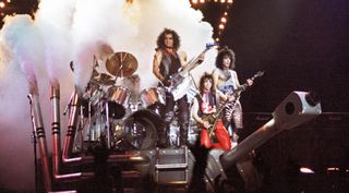 (from left) Gene Simmons, Vinnie Vincent and Paul Stanley perform with Kiss at Wembley Arena on October 23, 1983 in London