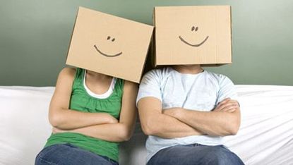 a couple with boxes on head