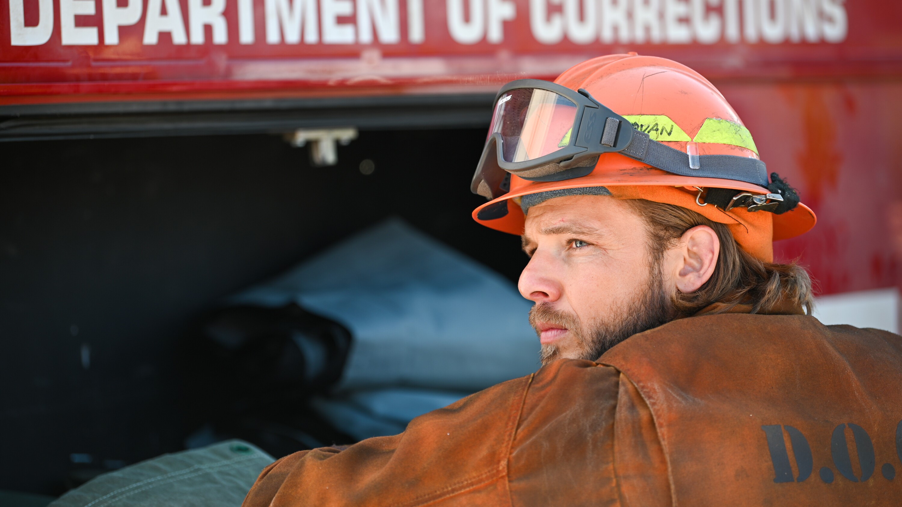 Max Thieriot as Bode Donovan gazing into the distance in Fire Country