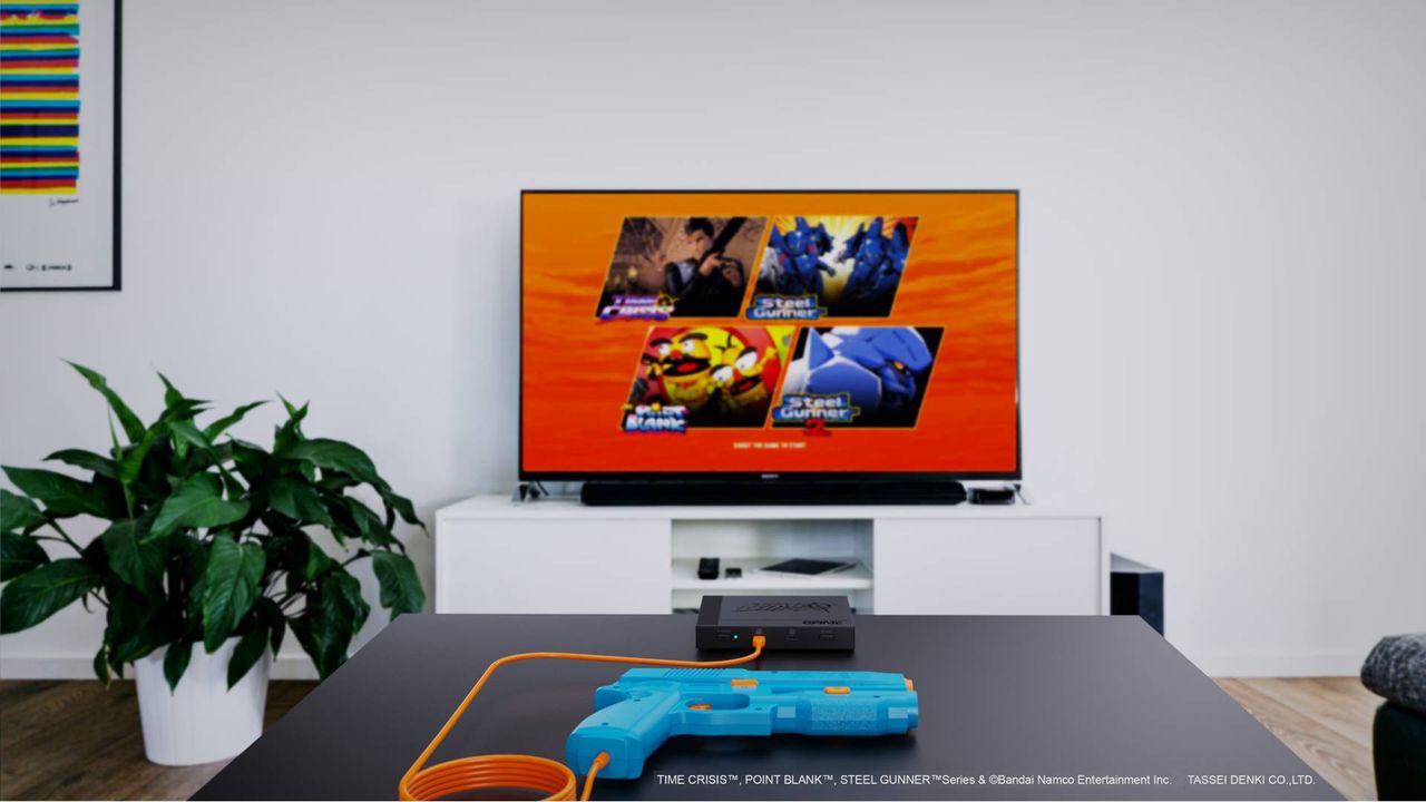 G'aim'e Time Crisis Plug and Play console setup in living room featuring TV on bench next to plant and console sitting on table in front.