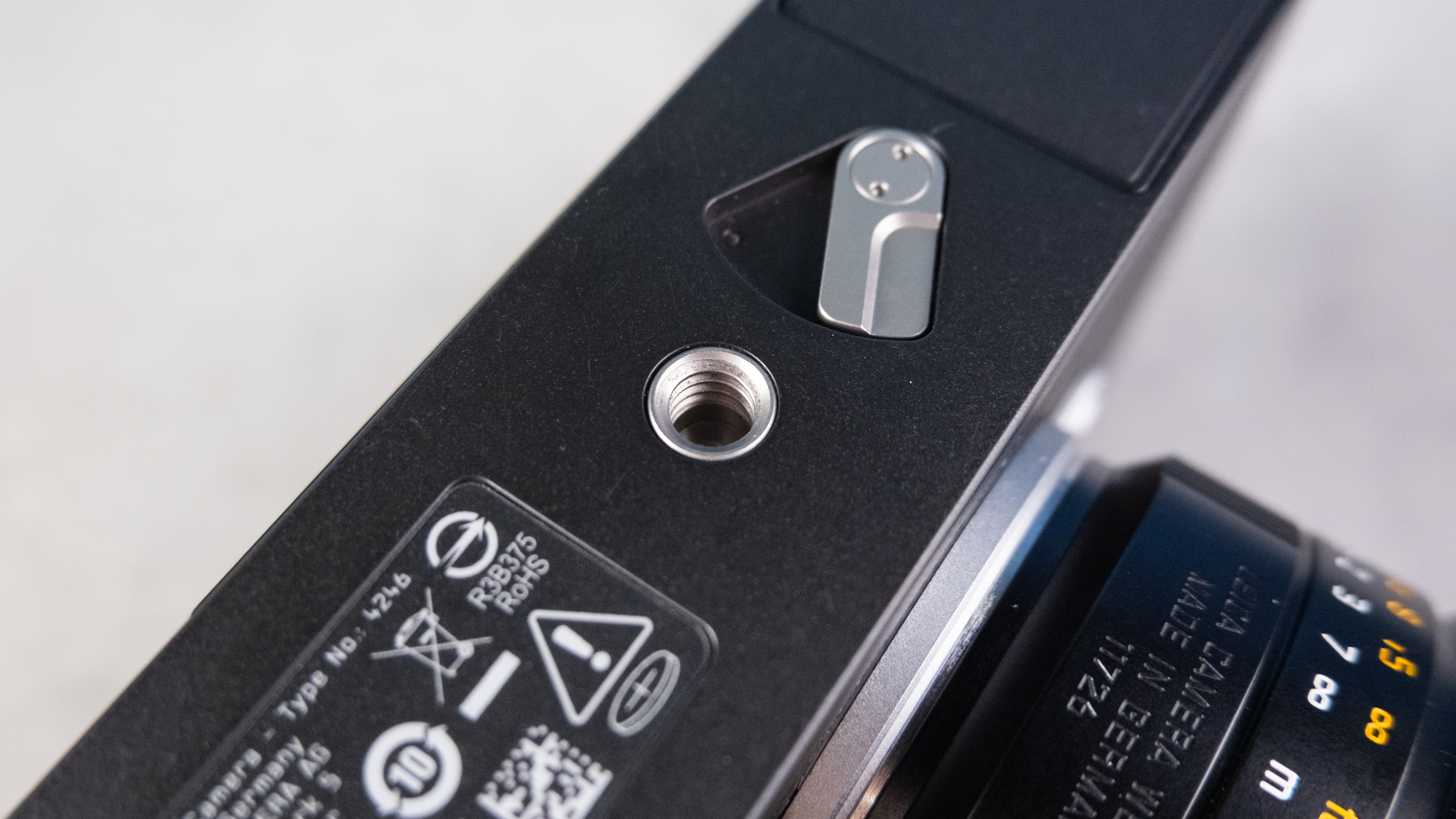 A black Leica M EV1 rangefinder-style camera