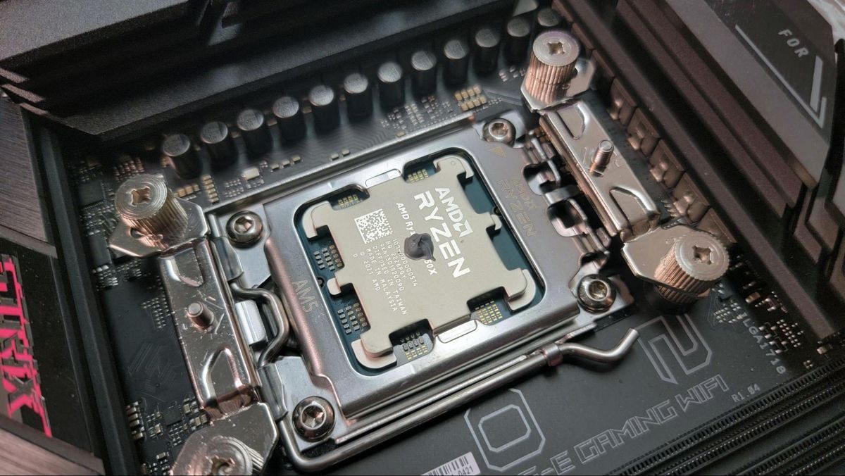 CPU cooler mounting hardware installed on an AM5 motherboard