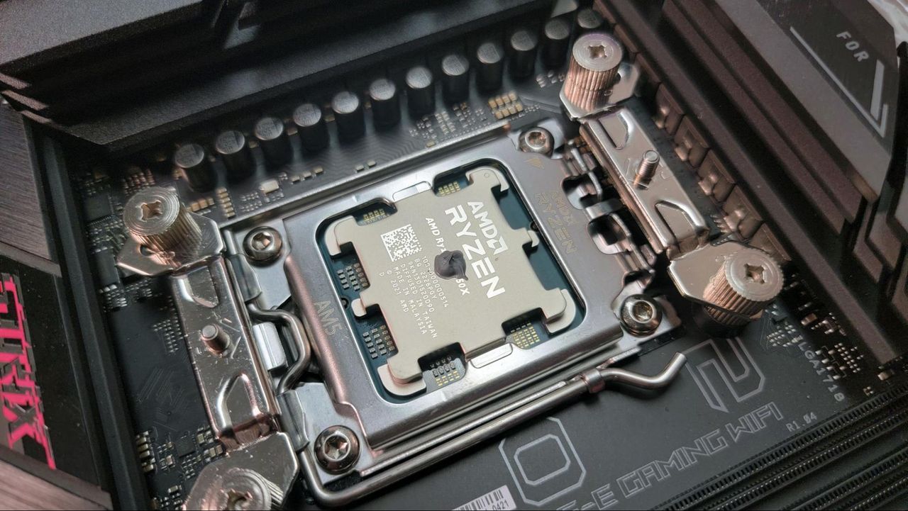 CPU cooler mounting hardware installed on an AM5 motherboard