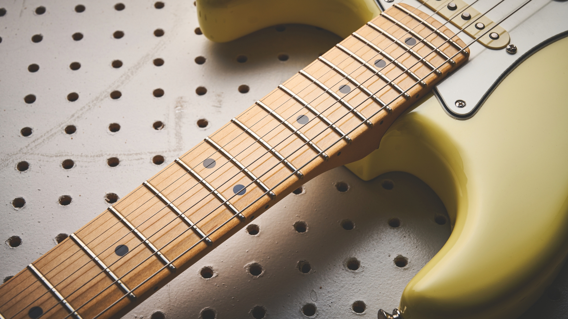 Close up of the maple neck on a Fender Player II Stratocaster electric guitar