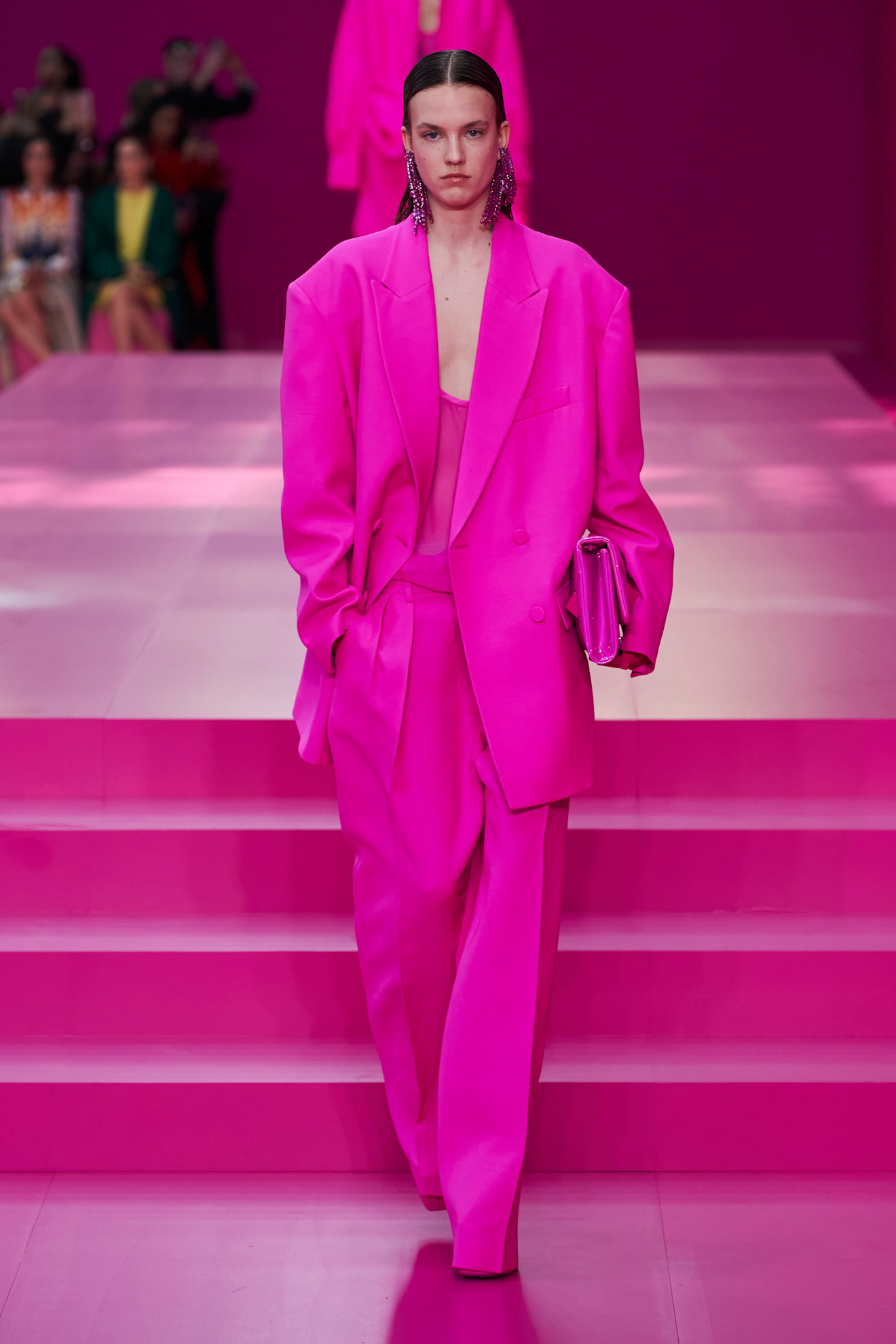 Valentino’s autumn/winter 2022 collection. In an image sourced from Launchmetrics the model wears a full bright pink attire.