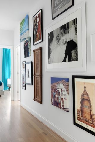 A white hallway with a gallery wall