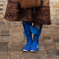 blue boxing shoes with a brown skirt. 