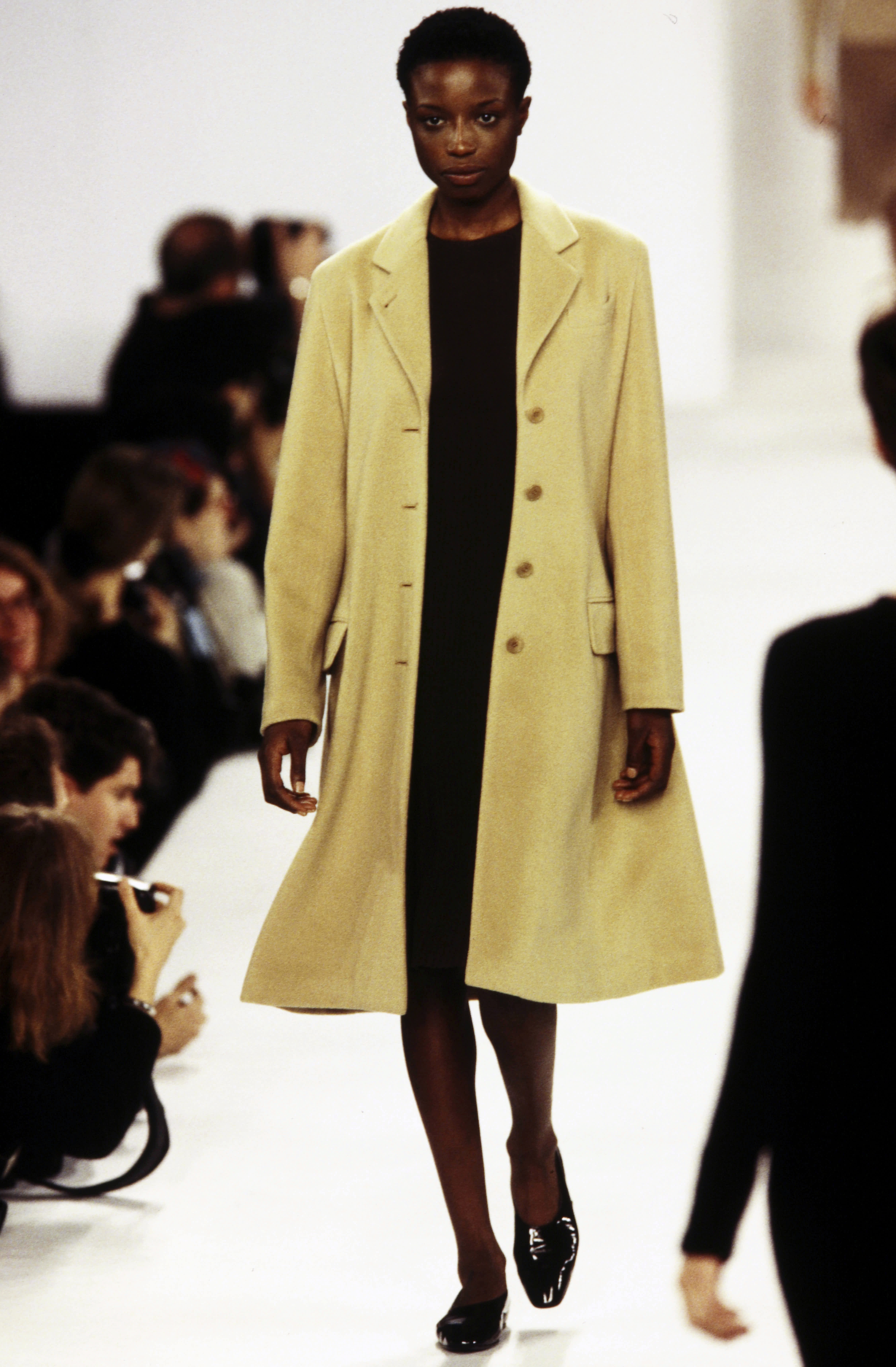 Model Kiara Kabukuru walking Calvin Klein Collection Fall 1994 Ready To Wear Runway Show.
