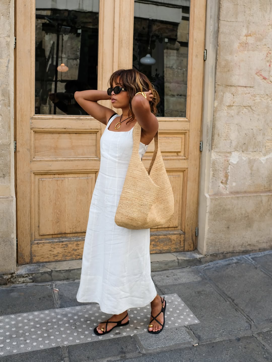 @slipintostyle in a white linen dress with sandals with chic gold hardware