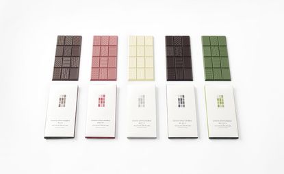 Five different colours and flavours chocolate bars above images of their individual wrappings