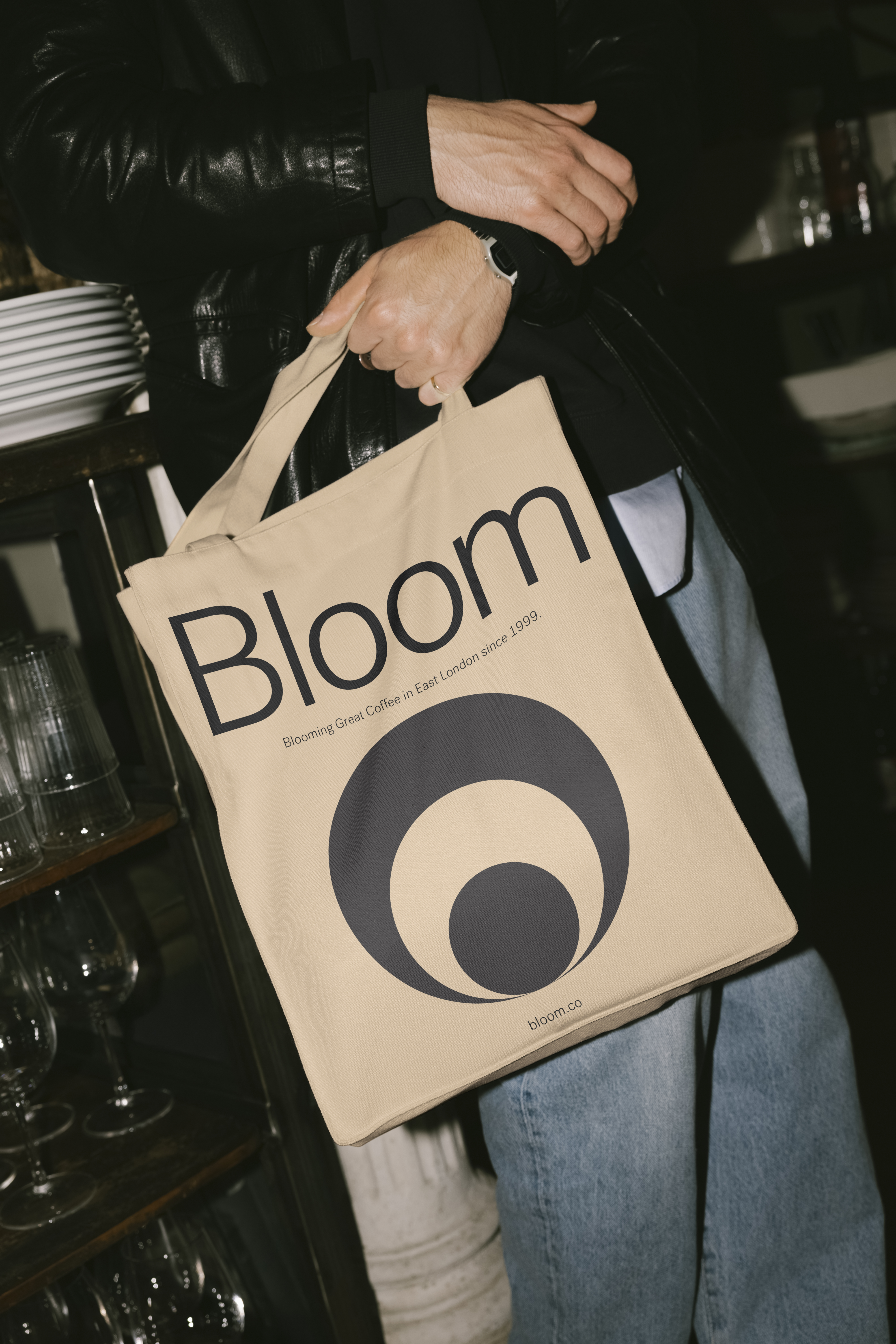 Bloom tote bag held by a person