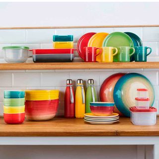 colourful casserole dishes and plates on wooden countertop