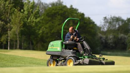 Greenkeeper pictured on mower