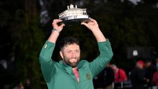 Jon Rahm lifts the trophy after his Masters victory