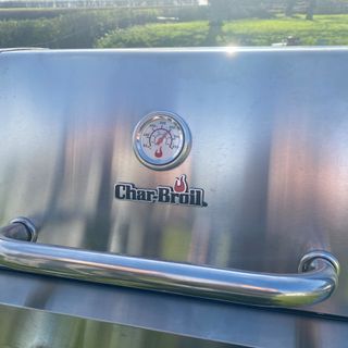 Up close of Char-Broil BBQ in field of temperature gauge