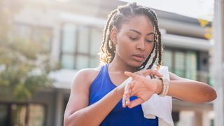 Woman using sports watch during a run