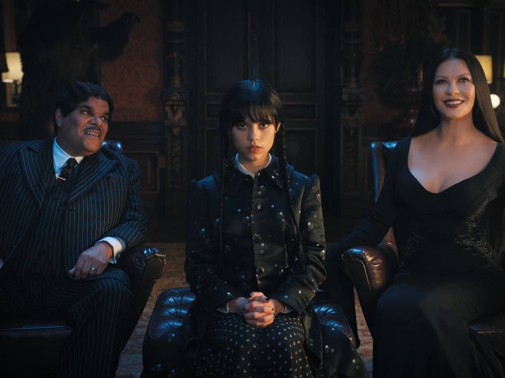 Luis Guzmán as Gomez Addams, Jenna Ortega as Wednesday Addams, Catherine Zeta-Jones as Morticia Adams