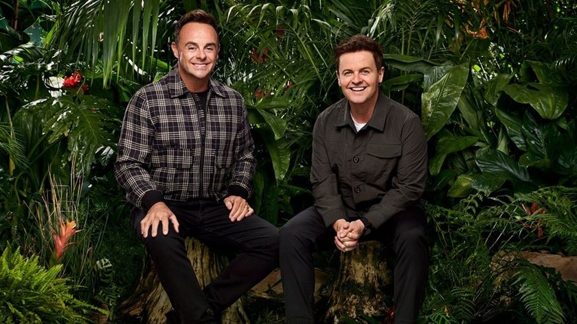 Against lush green foliage, hosts Ant McPartlin and Declan Donnelly sit on tree stumps sporting Cheshire cat grins, anticipating the arrival of the latest celebrity campmates for &quot;I&#039;m a Celeb&quot; 2025.
