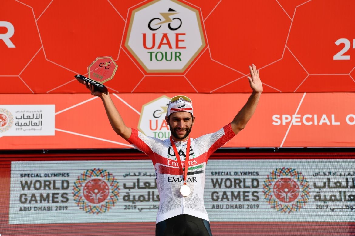 Fernando Gaviria celebrates his stage victory on the podium