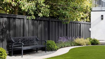 a dark grey garden fence