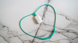 Upright Go 2 posture corrector on a marble table