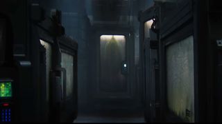 an egg-shaped mass can be seen inside a glass and metal case in a dimly lit room full of similar cases