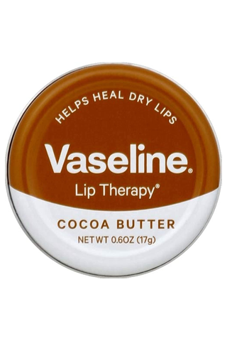 A closed pot of cocoa butter-flavored Vaseline Lip Therapy set against a white background.