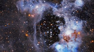 The view is of stars in a nebula, or gas cloud, known as N44, that is located in a nearby galaxy called the Large Magellanic Cloud