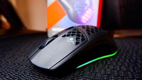 SteelSeries Aerox 3 Wireless gaming mouse at various angles on a black mesh background