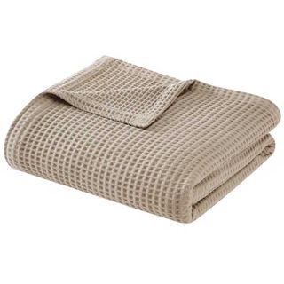 taupe waffle weave throw to support the quiet luxury trend for interiors