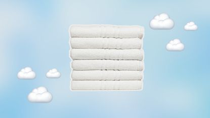 Stack of white towels on blue background with clouds