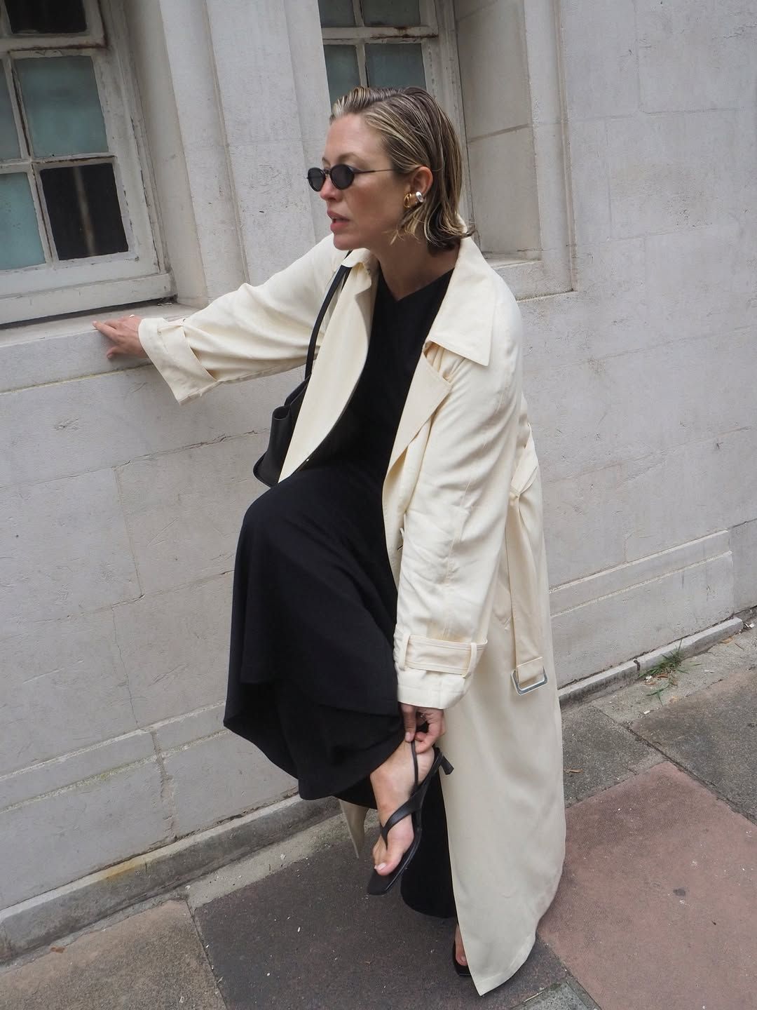 Alexis in sandals and trench coat