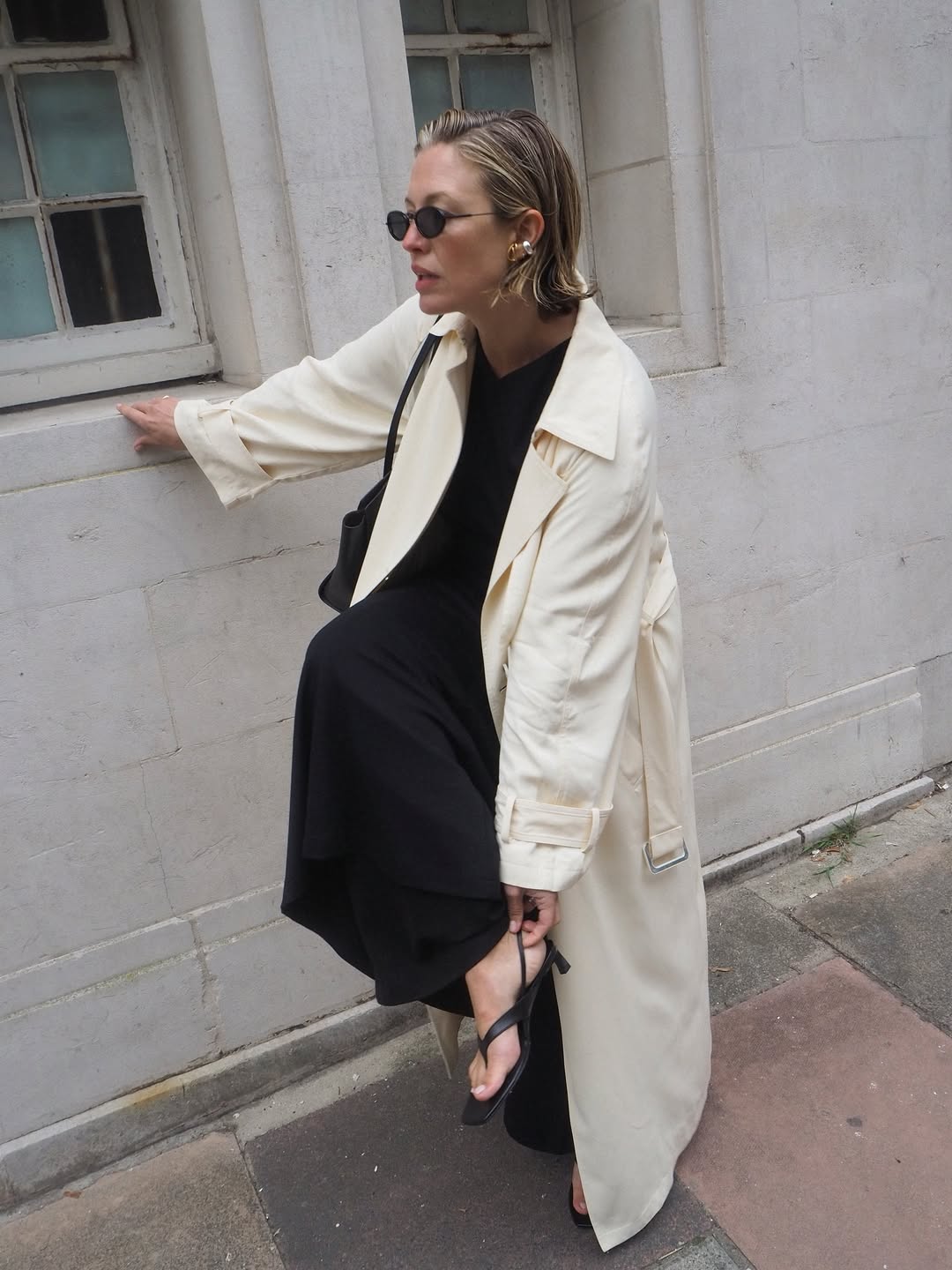 Alexis in sandals and trench coat