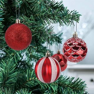 red ornaments on christmas tree