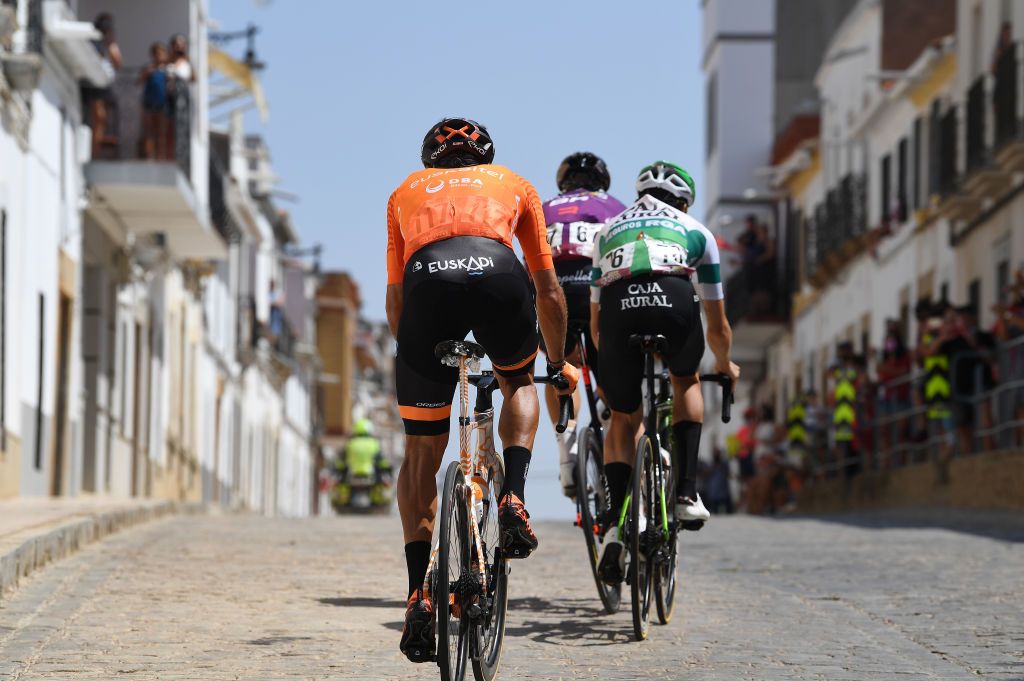 VILLANUEVA DE LA SERENA SPAIN AUGUST 27 Detailed view of Luis ngel Mat Mardones of Spain and Team Euskaltel Euskadi Alvaro Cuadros Morata of Spain and Team Caja RuralSeguros RGA and Diego Rubio Hernandez of Spain and Team Burgos BH in the breakaway passing through Monterrubio de la Serena village landscape during the 76th Tour of Spain 2021 Stage 13 a 2037km stage from Belmez to Villanueva de la Serena lavuelta LaVuelta21 on August 27 2021 in Villanueva de la Serena Spain Photo by Tim de WaeleGetty Images