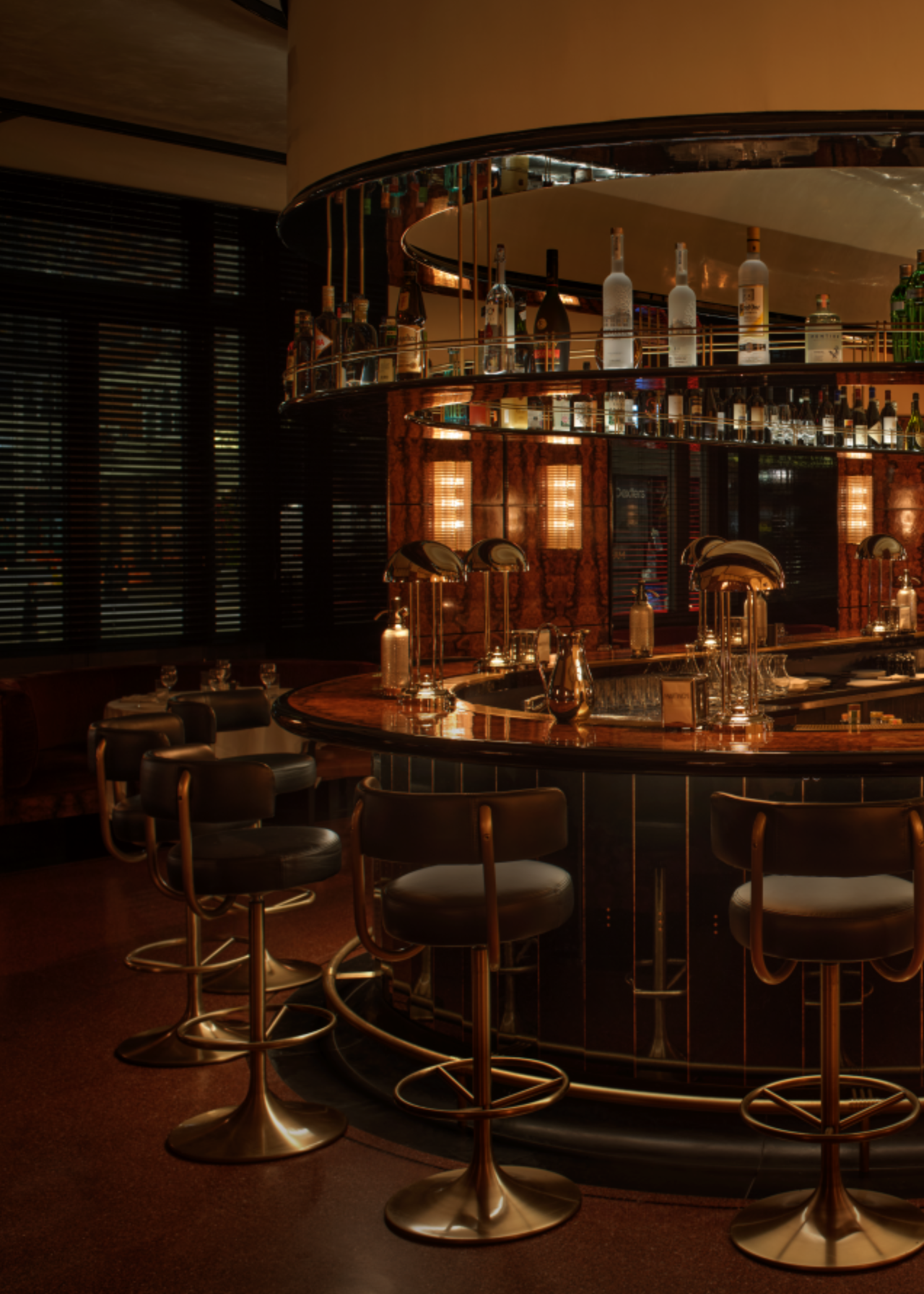 Oval bar in martinos with chrome lamps decorating the surface