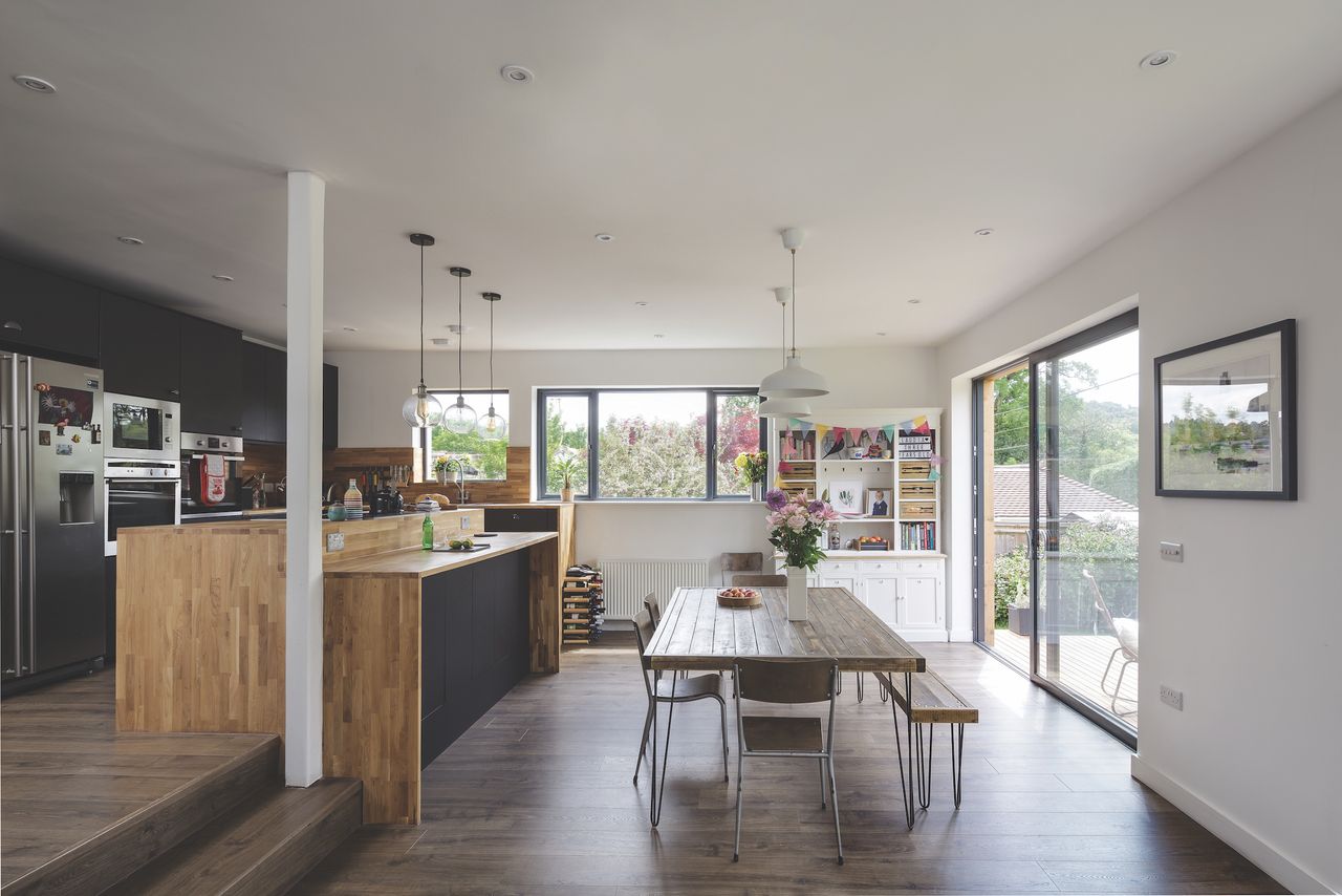 The Ikea kitchen was topped with an oak worktop (from Worktop Express) that extends over the back of the island. All of the appliances are second-hand to keep costs even lower.
