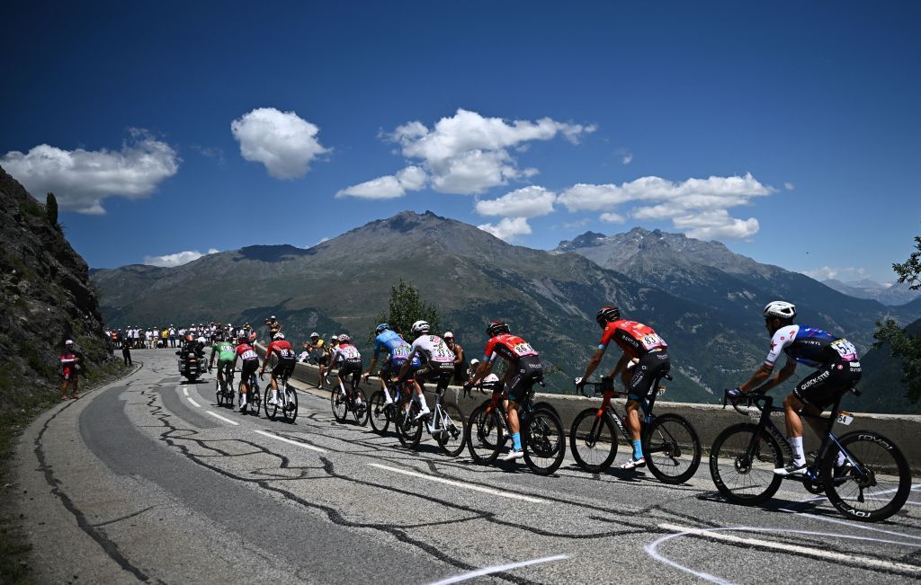The pack of riders cycles in the French Alps during the 11th stage of the 109th edition of the Tour de France cycling race 1517 km between Albertville and Col du Granon Serre Chevalier in the French Alps on July 13 2022 Photo by AnneChristine POUJOULAT AFP Photo by ANNECHRISTINE POUJOULATAFP via Getty Images
