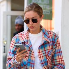 Gigi Hadid wearing a plaid shirt