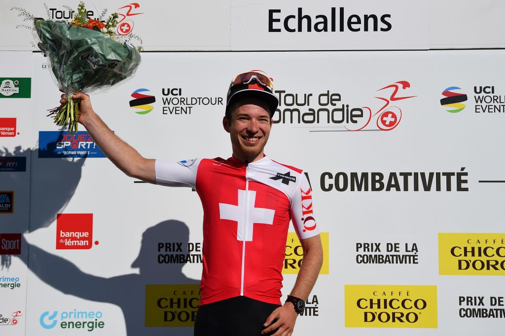 OULENSSOUSECHALLENS SWITZERLAND APRIL 28 Nils Brun of Switzerland and Team Switzerland celebrates winning the trophy for the most combative rider on the podium ceremony after the 75th Tour De Romandie 2022 Stage 2 a 1682km stage from challens to challens TDR2022 on April 28 2022 in OulenssousEchallens Switzerland Photo by Dario BelingheriGetty Images