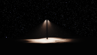 a tower bathes the moon's surface below it in light, while darkness surrounds the circle of light it projects. stars can be seen outside of the cone of light