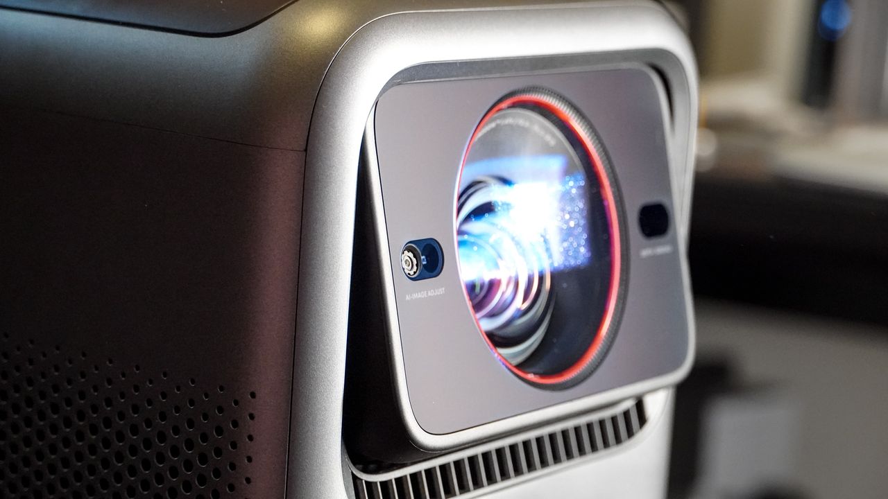 The lens on an Anker Nebula X1 projector tilting upward.