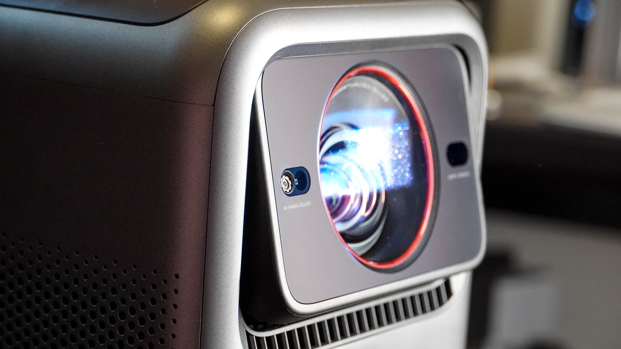 The lens on an Anker Nebula X1 projector tilting upward.