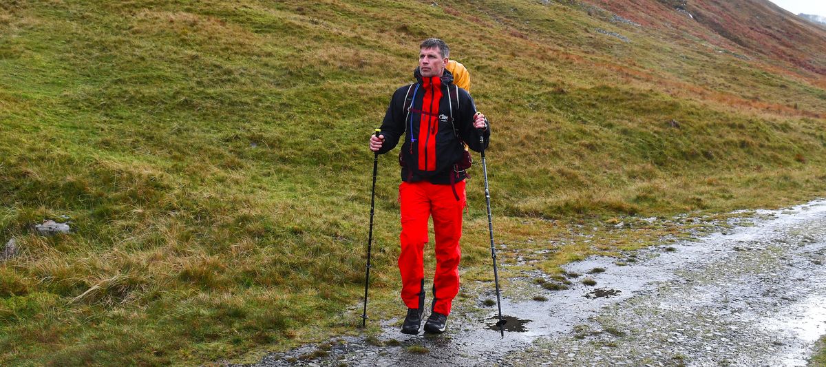 Man wearing Haglöfs LIM ZT Trek GTX PRO Jacket in the rain