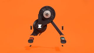 An exploded view of the feet on the Zwift Hub on an orange background