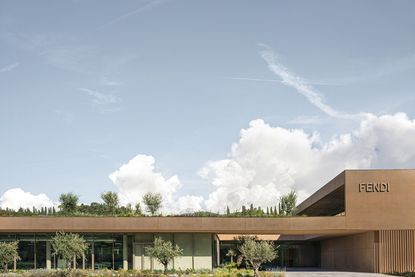 hero exterior with blue skies at fendi factory in tuscany