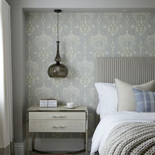 bedroom with pendant over bedside table